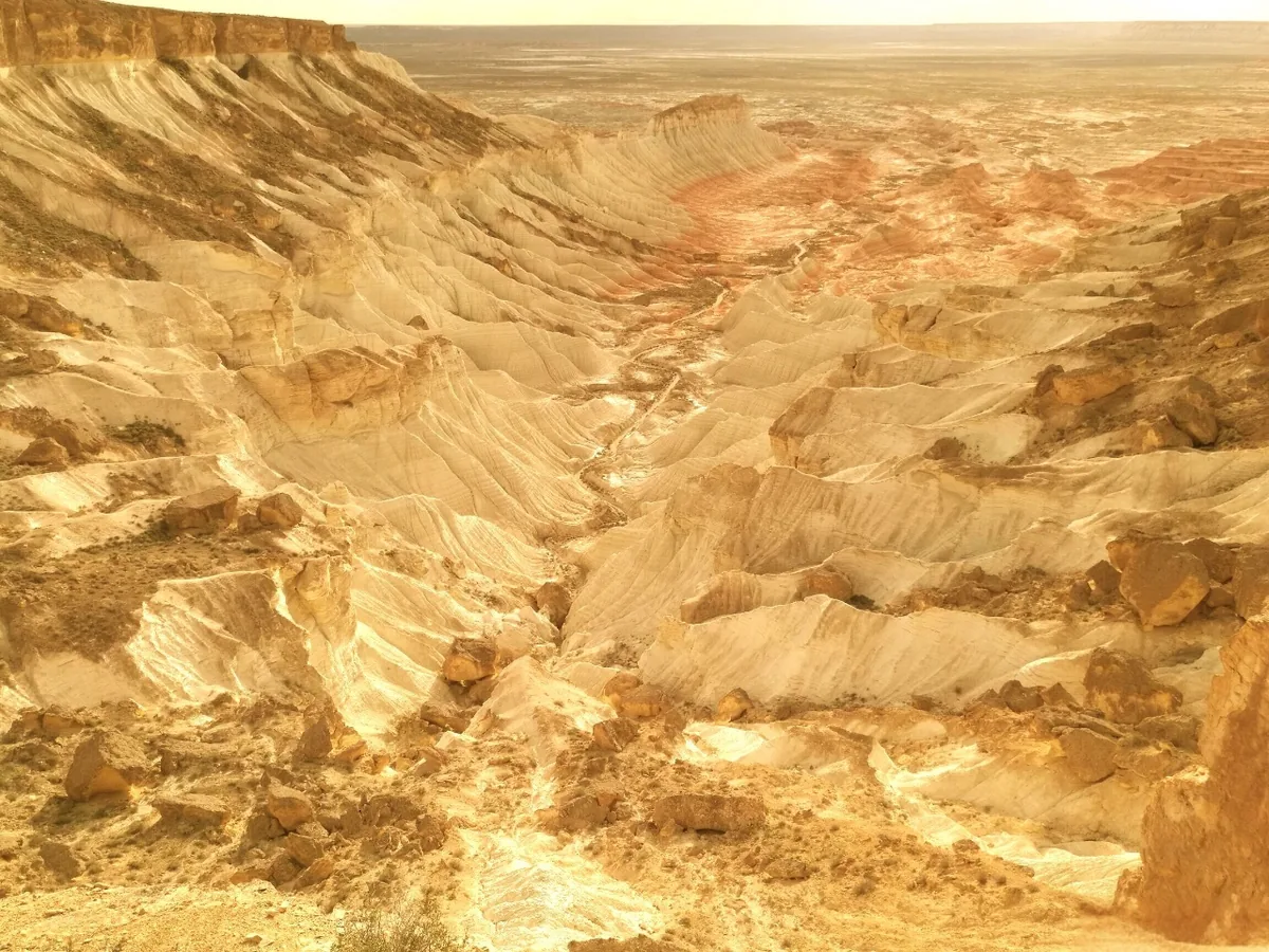 Yangykala Canyons in Turkmenistan with white and red layered cliffs overlooking the desert