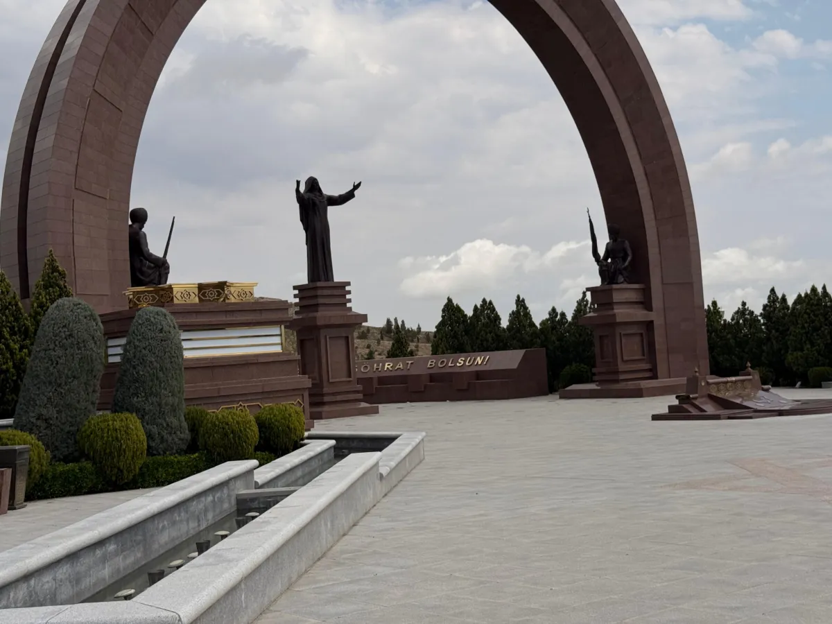 Majestic arch and bronze statues of heroes in the Halk Hakydasy Memorial Complex in Ashgabat