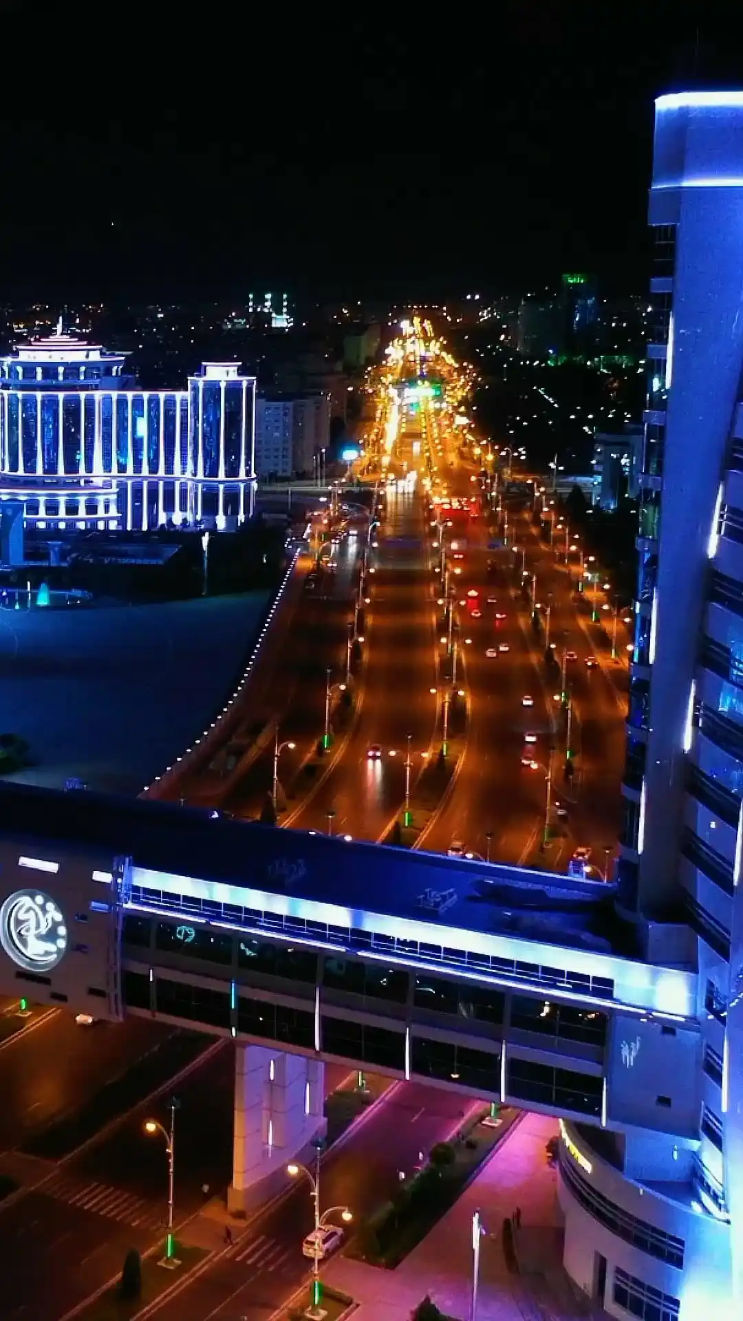 Night panorama of Ashgabat with illuminated boulevards, modern architecture and a glass skybridge — Turkmenistan tours | TM Tourism